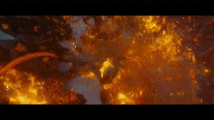 a close up of a fire with a lot of flames coming out of it
