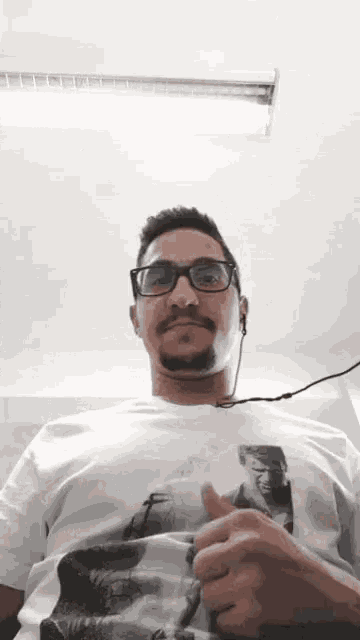 a man wearing a t-shirt with a picture of frankenstein on it