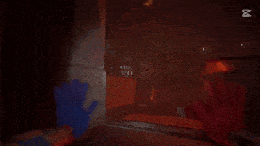 a person is playing a video game with a red and blue hand