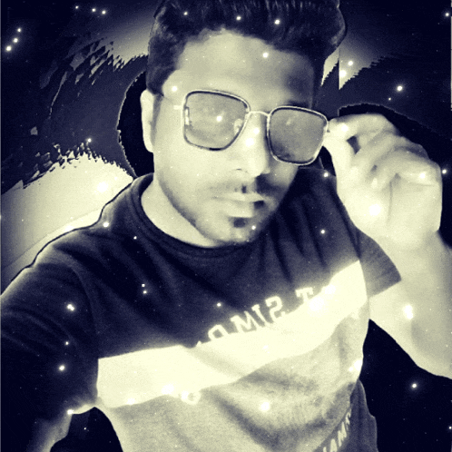 a man wearing sunglasses and a t-shirt that says amir