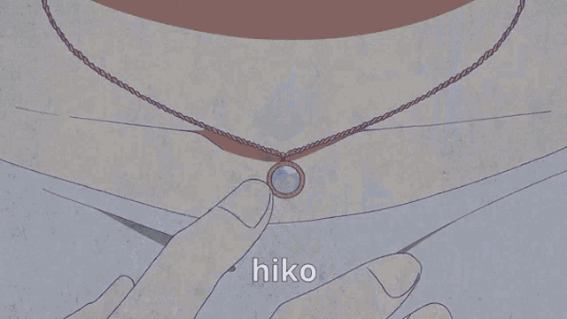 a man sits at a table in a living room with the word hiko written on the floor
