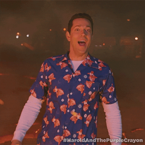 a man in a hawaiian shirt is standing in front of a fire with the hashtag #haroldandthepurplecrayon