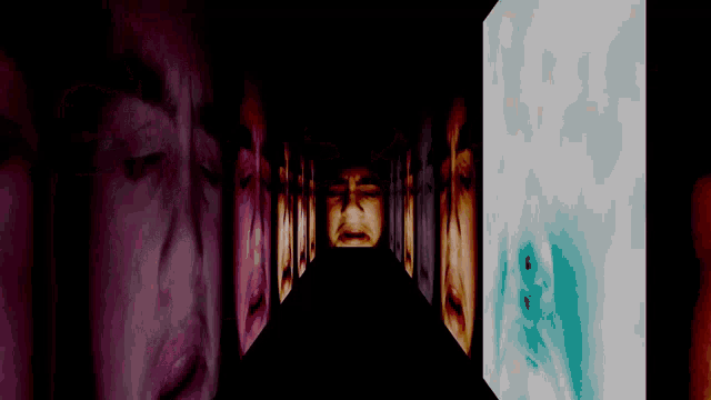 a person 's face is being projected in a dark room