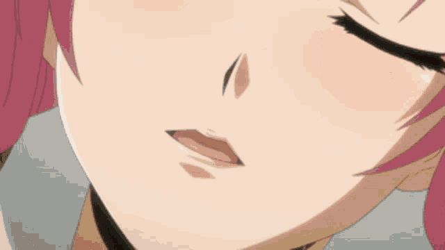 a close up of a person 's mouth with sharp teeth