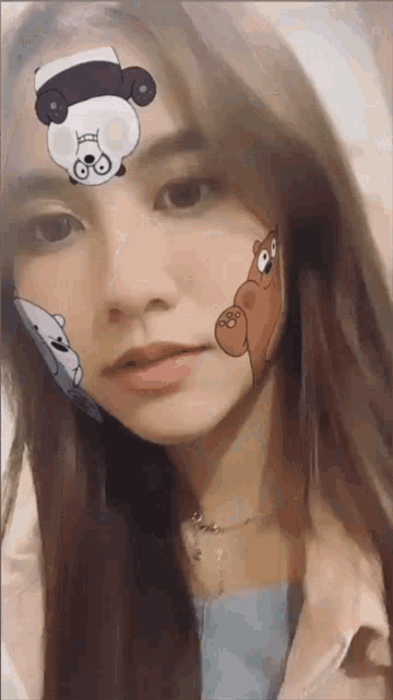 a woman with a panda bear on her forehead