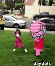 a little girl is being pulled by a pig mascot that says bay bots