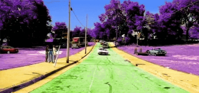 a painting of a street with purple trees and cars on it