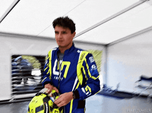 a man in a blue jacket with the number 47 on it