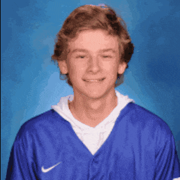 a young man is wearing a blue nike jersey