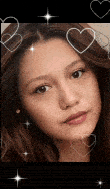 a close up of a woman 's face surrounded by hearts and stars