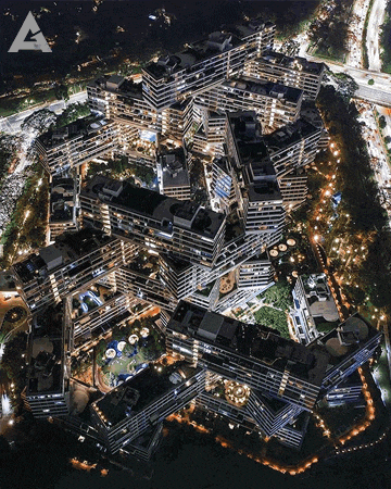 an aerial view of a city at night with a lot of buildings