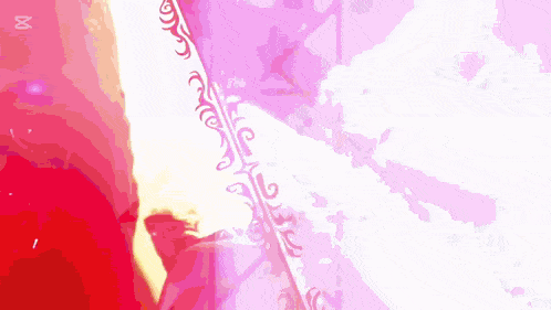 a woman in a red dress is standing in front of a pink background