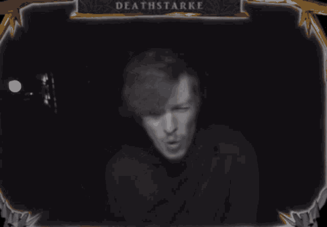 a black and white photo of a man with deathstarke written on the bottom