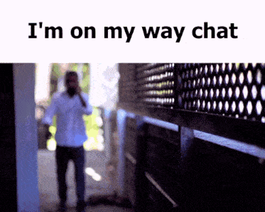 a man walking down a hallway with the words i 'm on my way chat