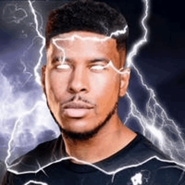a man with lightning bolts coming out of his eyes is looking at the camera .