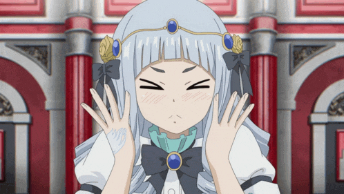 a girl with a crown on her head is making a face with her hands