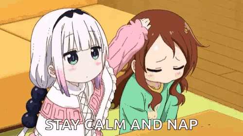 a couple of anime girls sitting next to each other with the words `` stay calm and nap '' .