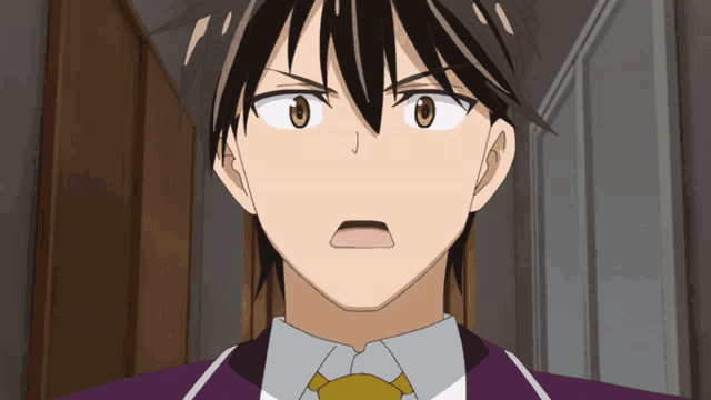 a man in a suit and tie is making a surprised face