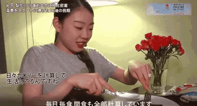 a woman is cutting a piece of food with a knife and fork
