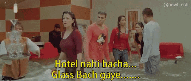 a group of people standing in a flooded room with the caption hotel nahi bacha glass bach gave