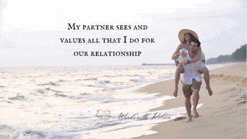 a man carrying a woman on his shoulders on the beach