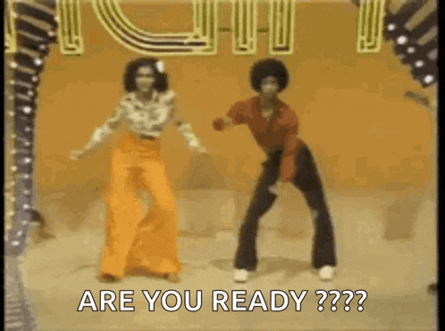 a man and a woman are dancing on a stage and the man is saying `` are you ready ? ''