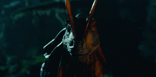 a close up of a dragon 's face with its mouth open .