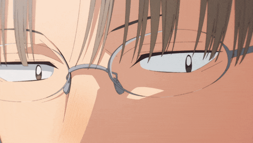a close up of a man 's eyes with glasses