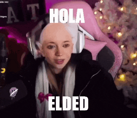 a girl with white hair is sitting in a pink chair and says hola elden