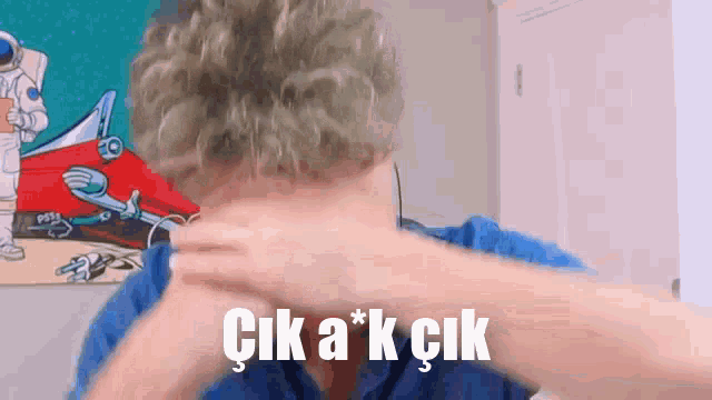 a person covering their face with their hands and the words ' çik a * k çik ' written on the bottom