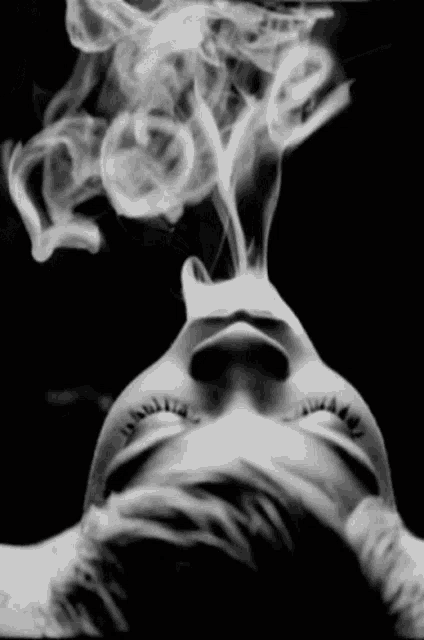 a woman with smoke coming out of her mouth
