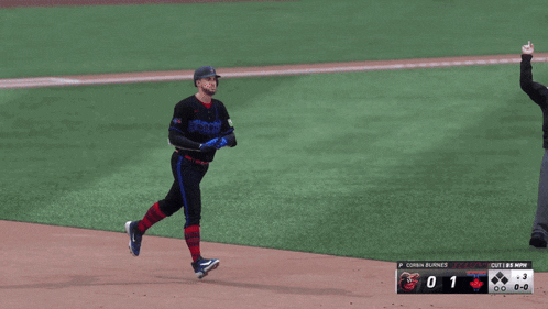 a blue jays baseball player named george springer is running to first base
