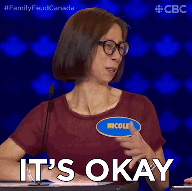 a woman with a name tag that says nicole on it says it 's okay