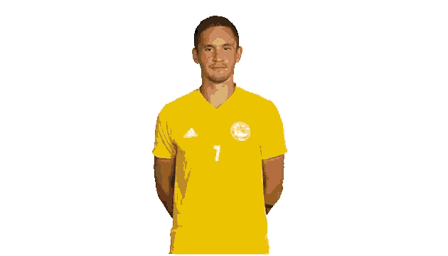 a man wearing a yellow adidas shirt with the number 7 on it