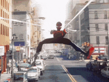 a man in a spiderman costume is flying through the air with the words blitzhelizard written below him