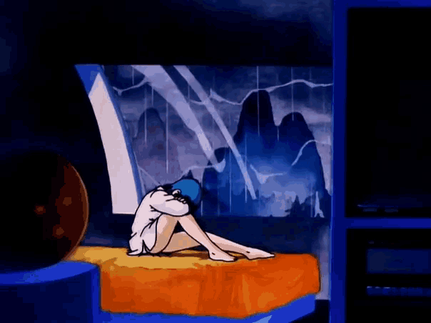 a cartoon character is sitting on a bed with her head down