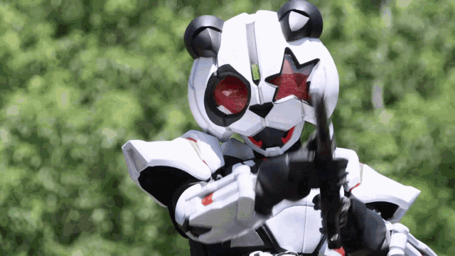 a robotic panda bear with a red star on its eyes