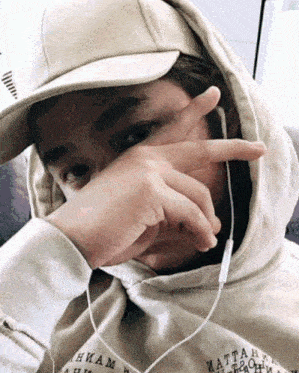 a person wearing a hat and a hoodie with the word matta on it