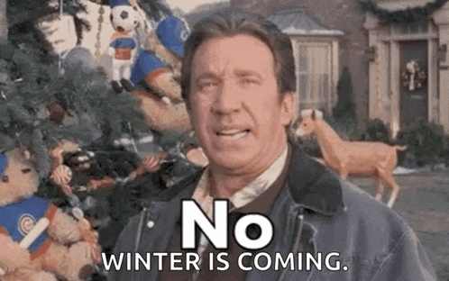 a man is standing in front of a christmas tree with stuffed animals and says `` no winter is coming '' .