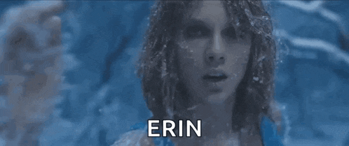 a close up of a woman 's face with the name erin written on it .