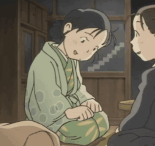a girl in a kimono sits next to another girl in a room