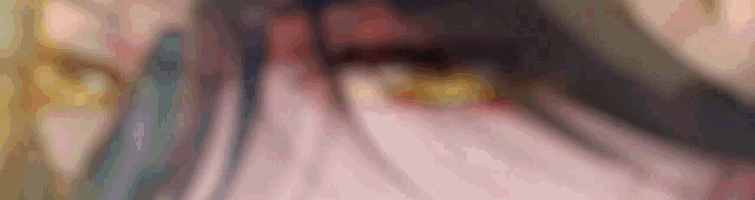 a close up of a person 's face with a blurry background