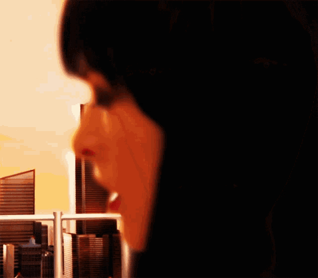 a close up of a woman with her mouth open