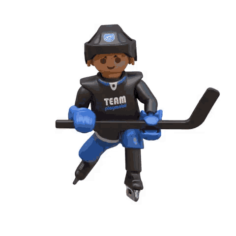 a playmobil hockey player is holding a hockey stick and a puck