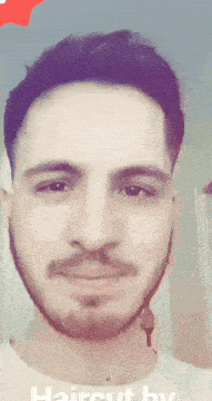 a close up of a man 's face with the words haircut by written below it