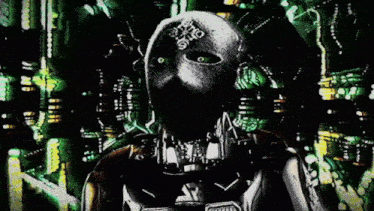a man in a futuristic helmet stands in front of a green background