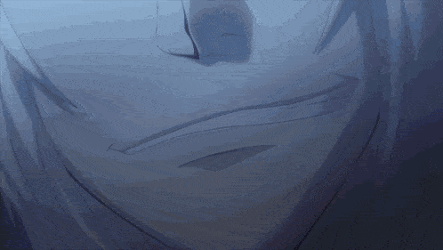 a close up of a person 's face with a slight smile on their face