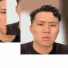 a close up of a man 's face in a black shirt