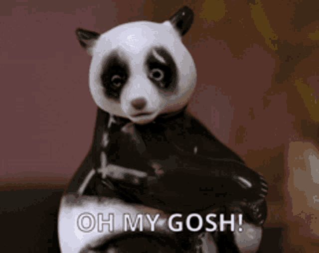 a statue of a panda bear with the words oh my gosh below it