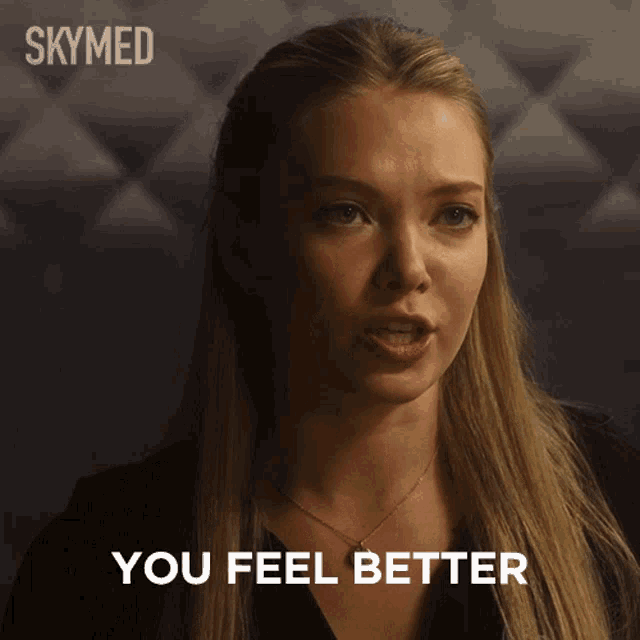 a woman says " you feel better " in front of a skymed ad